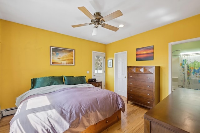 143 Tuthill Rd, Montauk, NY 11954 - bedroom featuring light wood finished floors, connected bathroom, ceiling fan, and baseboard heating
