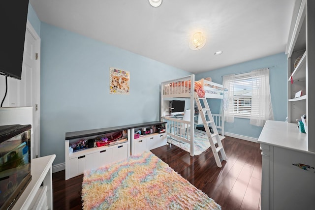 bedroom with dark wood-style flooring, baseboards, recessed lighting, and a desk