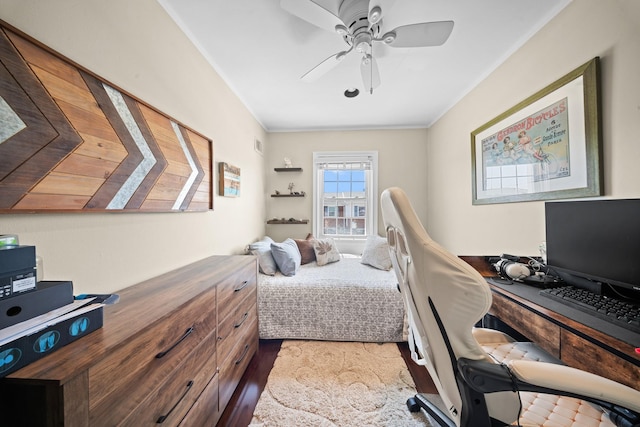 bedroom with a desk, crown molding, and a ceiling fan
