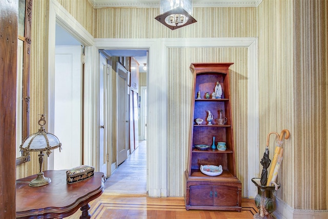 34-06 81st Unit 42, Jackson Heights, NY 11372 - corridor featuring ornamental molding, wallpapered walls, and wood finished floors