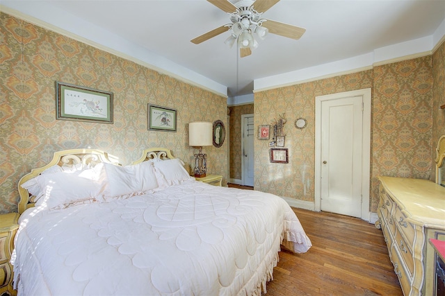 34-06 81st Unit 42, Jackson Heights, NY 11372 - bedroom featuring wallpapered walls, baseboards, ceiling fan, and hardwood / wood-style flooring