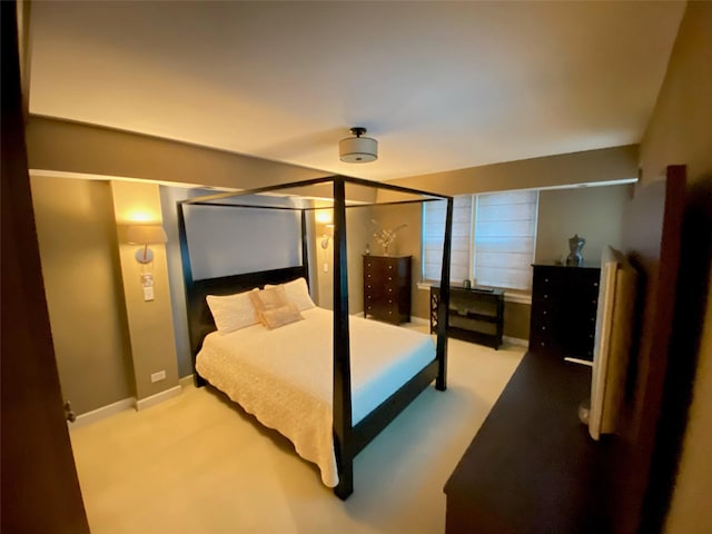 bedroom featuring carpet floors and baseboards