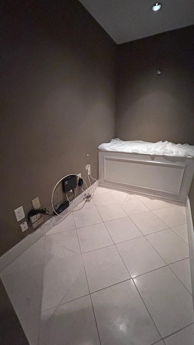 bathroom featuring tile patterned flooring and baseboards
