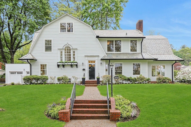490 Bellwood Ave, Sleepy Hollow, NY 10591 - colonial inspired home with a chimney, a front lawn, a gambrel roof, and a high end roof