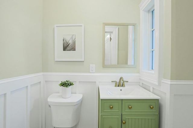 490 Bellwood Ave, Sleepy Hollow, NY 10591 - bathroom with plenty of natural light, wainscoting, a decorative wall, vanity, and toilet