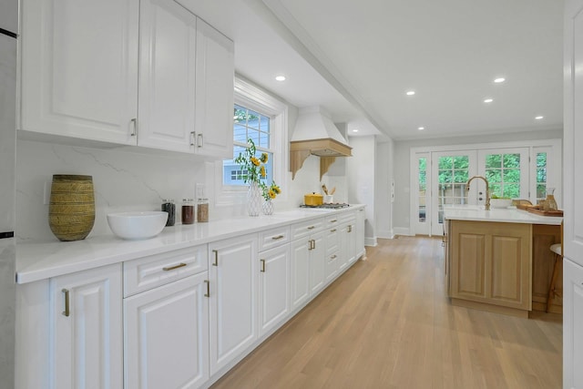 490 Bellwood Ave, Sleepy Hollow, NY 10591 - kitchen with light wood-style flooring, recessed lighting, white cabinetry, backsplash, and light countertops