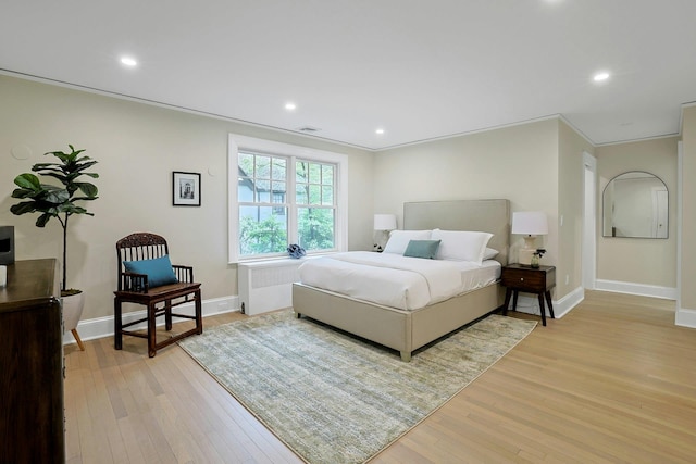 490 Bellwood Ave, Sleepy Hollow, NY 10591 - bedroom with radiator heating unit, light wood-type flooring, baseboards, and recessed lighting