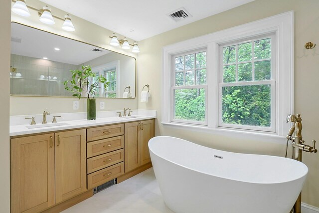 490 Bellwood Ave, Sleepy Hollow, NY 10591 - bathroom featuring double vanity, a soaking tub, and a tile shower