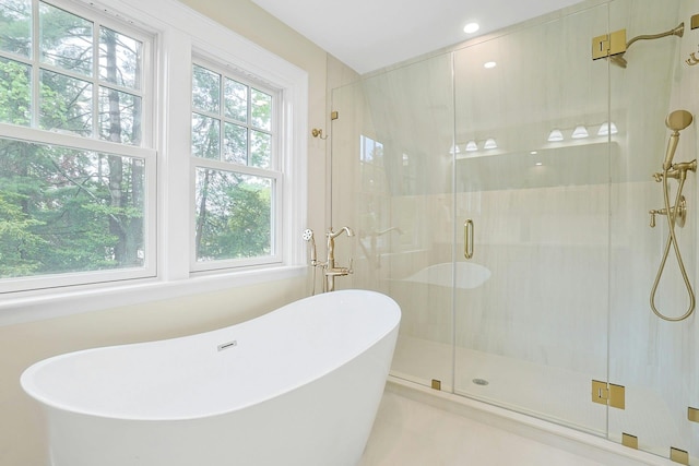 490 Bellwood Ave, Sleepy Hollow, NY 10591 - bathroom featuring a freestanding tub, a shower stall, recessed lighting, and tile patterned floors