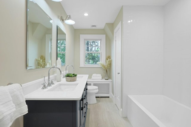 490 Bellwood Ave, Sleepy Hollow, NY 10591 - bathroom featuring toilet, vanity, and recessed lighting