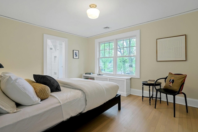 490 Bellwood Ave, Sleepy Hollow, NY 10591 - bedroom featuring radiator heating unit, baseboards, and light wood finished floors