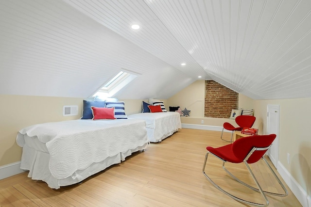 490 Bellwood Ave, Sleepy Hollow, NY 10591 - bedroom with wood finished floors, lofted ceiling, baseboards, a skylight, and recessed lighting