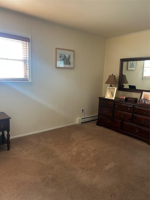 carpeted bedroom with a baseboard heating unit