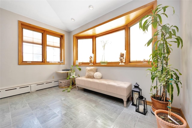 living area featuring vaulted ceiling and baseboard heating