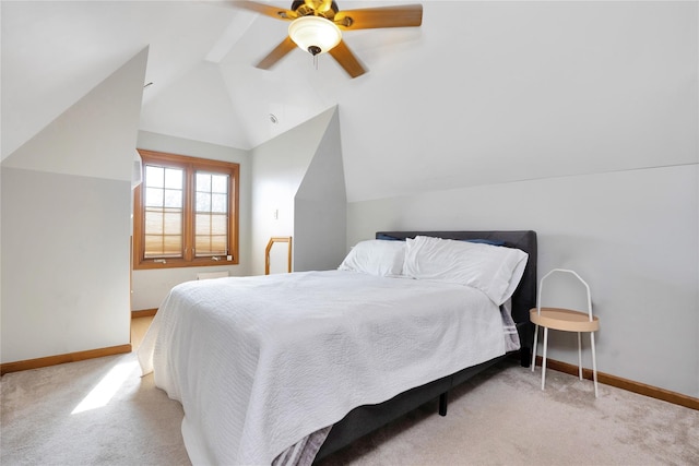carpeted bedroom featuring baseboards, a ceiling fan, and vaulted ceiling