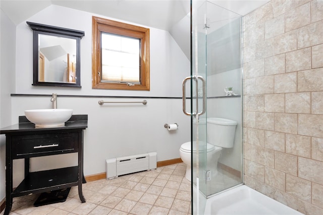 bathroom with a baseboard radiator, toilet, a shower stall, and vanity