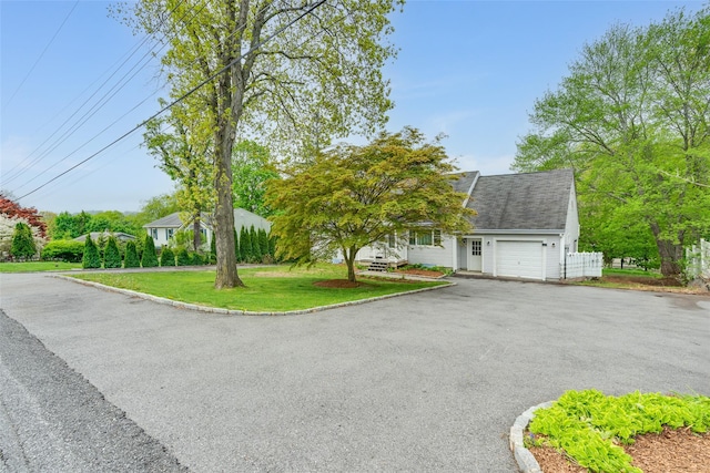 59 Longdale Rd, Mahopac, NY 10541 - view of front of home with a garage, driveway, and a front lawn