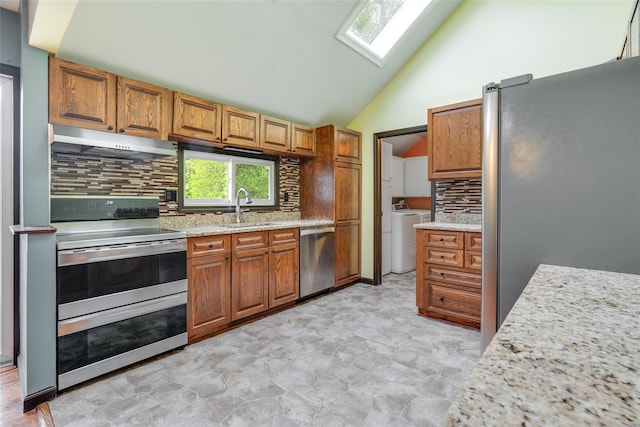 59 Longdale Rd, Mahopac, NY 10541 - kitchen with under cabinet range hood, appliances with stainless steel finishes, a sink, a skylight, and backsplash