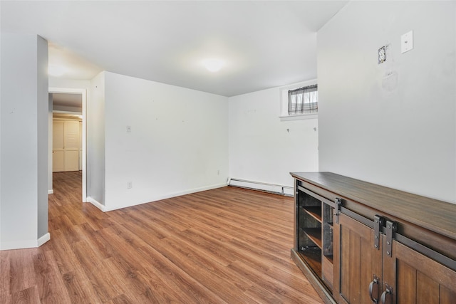 59 Longdale Rd, Mahopac, NY 10541 - spare room with baseboard heating, light wood-style floors, and baseboards