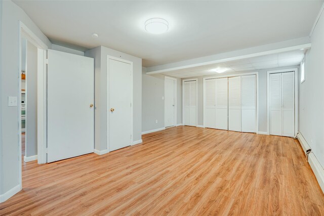 59 Longdale Rd, Mahopac, NY 10541 - unfurnished bedroom with two closets, light wood finished floors, and baseboards