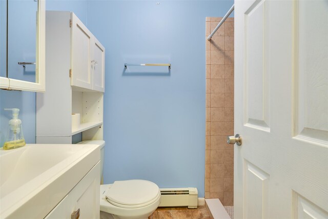 59 Longdale Rd, Mahopac, NY 10541 - bathroom with a baseboard heating unit, tiled shower, vanity, and toilet