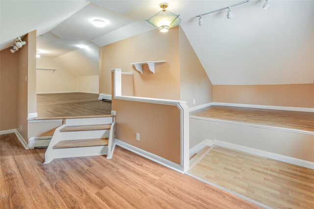59 Longdale Rd, Mahopac, NY 10541 - bonus room featuring a baseboard heating unit, wood finished floors, lofted ceiling, baseboard heating, and baseboards
