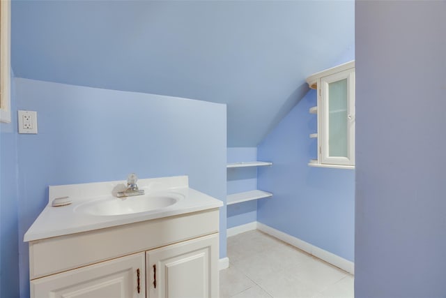 59 Longdale Rd, Mahopac, NY 10541 - bathroom featuring lofted ceiling, baseboards, vanity, and tile patterned floors