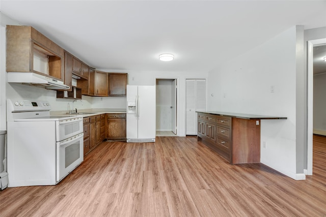 59 Longdale Rd, Mahopac, NY 10541 - kitchen with white appliances, light wood finished floors, and a sink