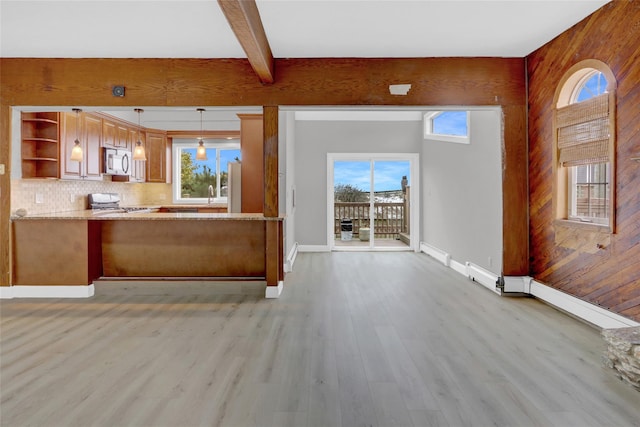 unfurnished living room featuring light wood-style flooring, beamed ceiling, wooden walls, and baseboards
