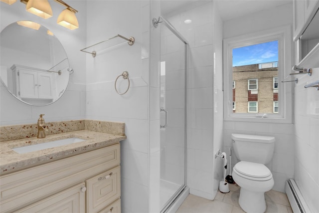 bathroom with a shower stall, toilet, a baseboard radiator, and tile patterned flooring