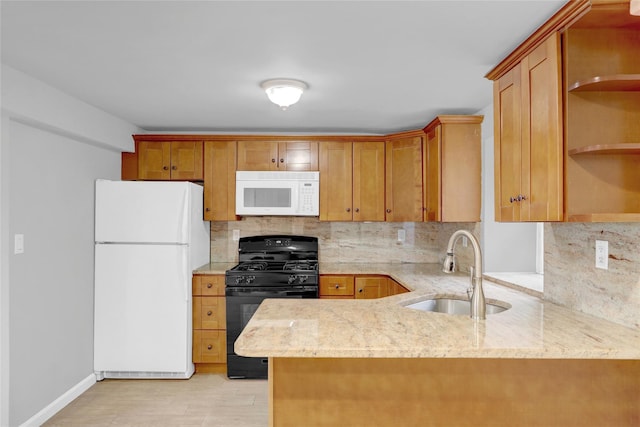 kitchen featuring a sink, a peninsula, white appliances, open shelves, and backsplash