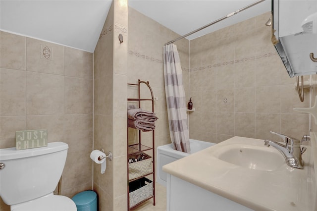 bathroom featuring toilet, tile walls, vanity, and a shower with shower curtain