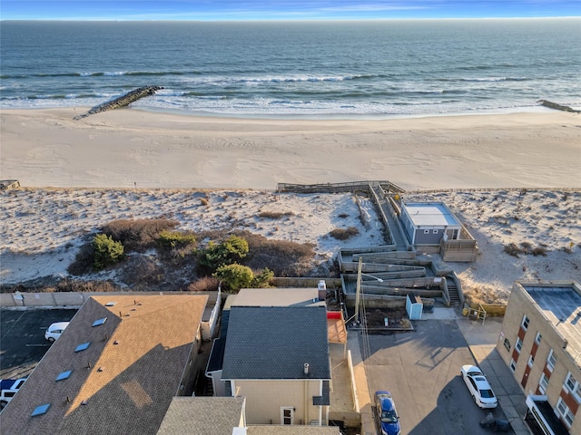aerial view with a water view and a view of the beach