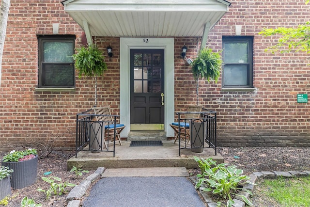 52 Rockledge Rd Unit 2A, Hartsdale, NY 10530 - doorway to property with brick siding and covered porch