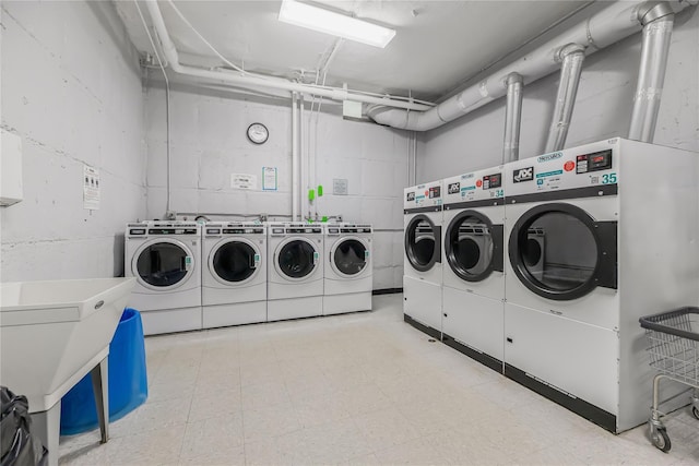 52 Rockledge Rd Unit 2A, Hartsdale, NY 10530 - shared laundry featuring washing machine and dryer and concrete block wall
