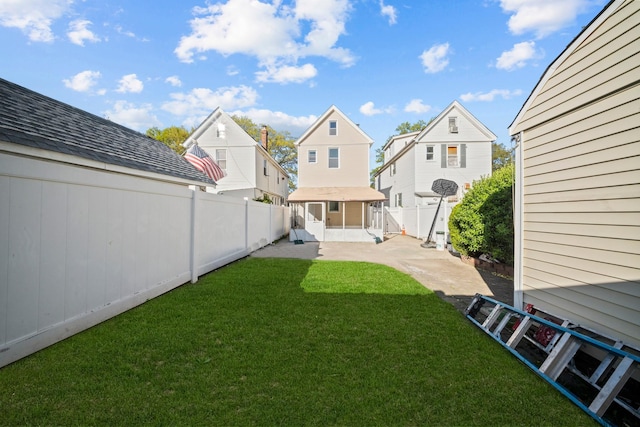 view of yard with a fenced backyard, a patio, and a residential view
