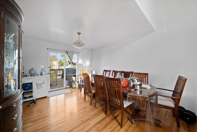 dining room featuring an inviting chandelier and light wood-style floors