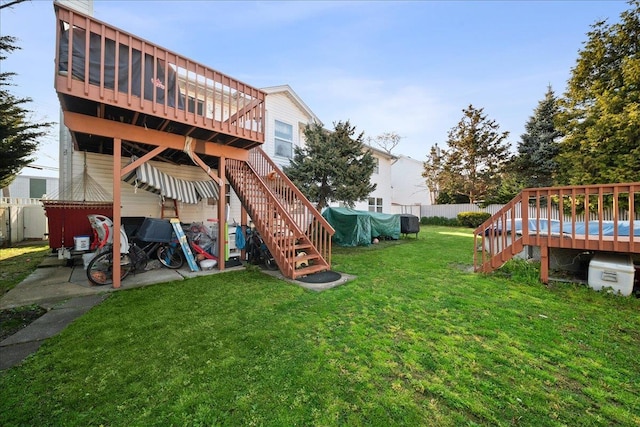 view of yard featuring stairway, fence, and a wooden deck