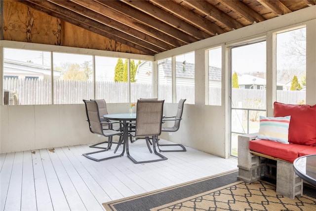 416 W St, Greenport, NY 11944 - sunroom / solarium featuring vaulted ceiling, hardwood / wood-style flooring, a wealth of natural light, and outdoor dining area
