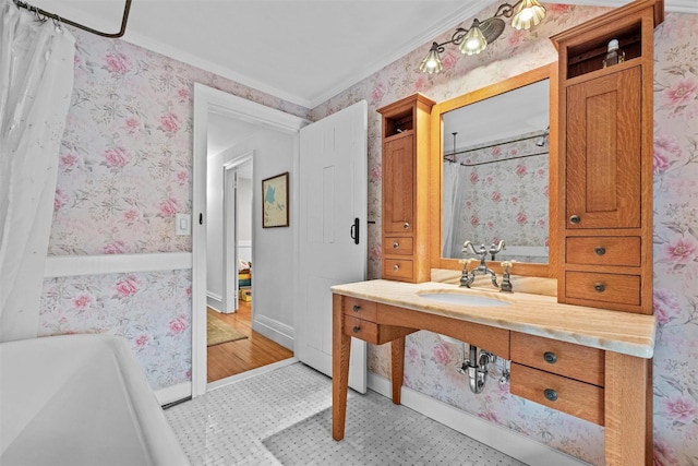 1005 Chapman St, Yorktown Heights, NY 10598 - bathroom featuring wallpapered walls, crown molding, vanity, baseboards, and a tub to relax in