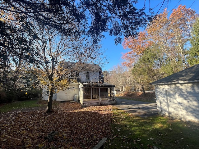 back of house with a sunroom