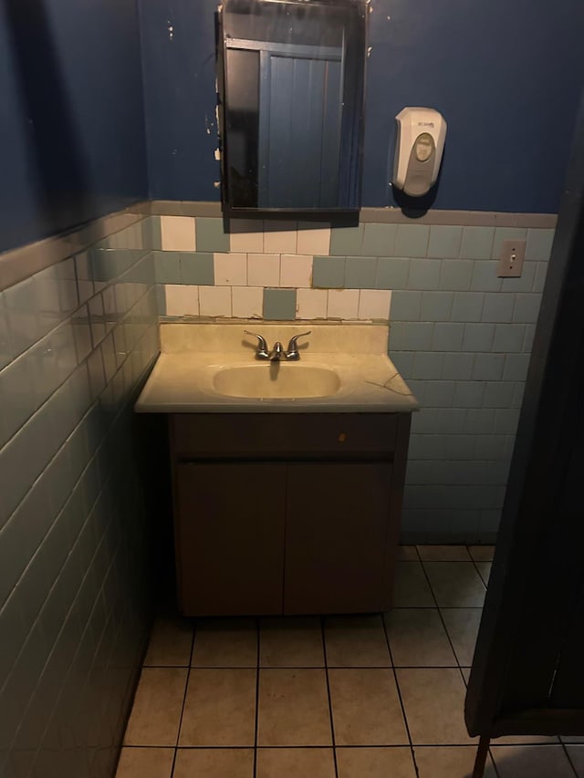 45 S Lander St, Newburgh, NY 12550 - bathroom with vanity, tile walls, a wainscoted wall, and tile patterned flooring