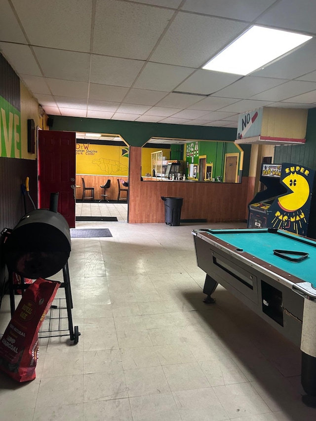 45 S Lander St, Newburgh, NY 12550 - game room featuring wood walls, tile patterned floors, and a drop ceiling