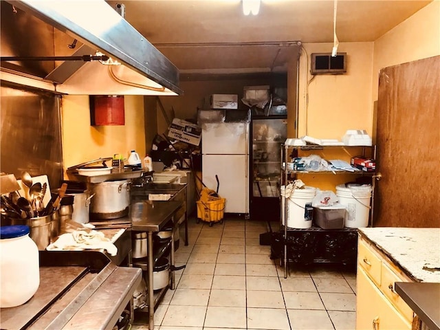45 S Lander St, Newburgh, NY 12550 - kitchen with freestanding refrigerator and light tile patterned floors