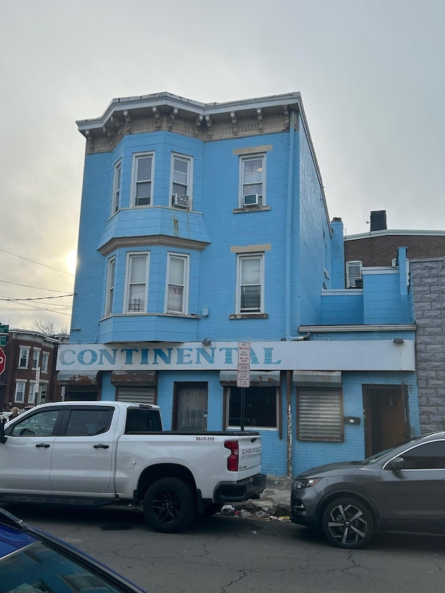45 S Lander St, Newburgh, NY 12550 - view of front of house with cooling unit and brick siding
