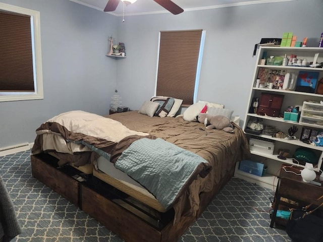 carpeted bedroom featuring a baseboard radiator, ornamental molding, and ceiling fan