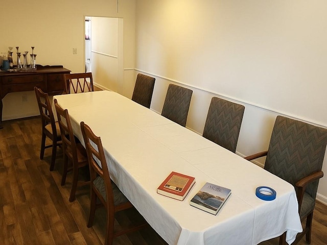 dining space with dark wood-style floors