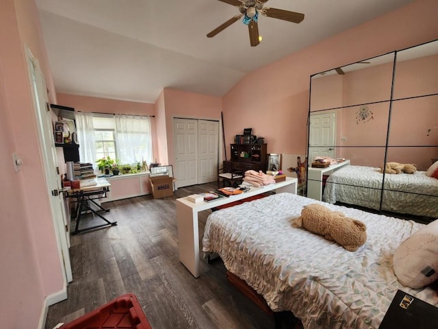 bedroom with a ceiling fan, vaulted ceiling, a closet, and wood finished floors