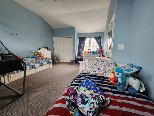 carpeted bedroom featuring a closet and vaulted ceiling