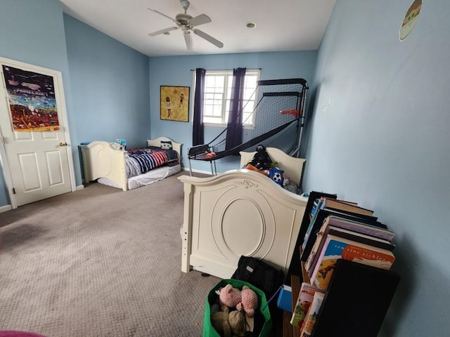 bedroom featuring baseboards, ceiling fan, and carpet floors